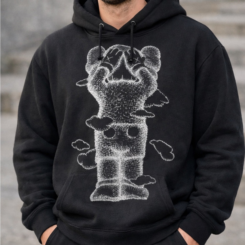 KAWS: Holiday Hoodie – Black Graphic Sweatshirt (United Kingdom Edition)